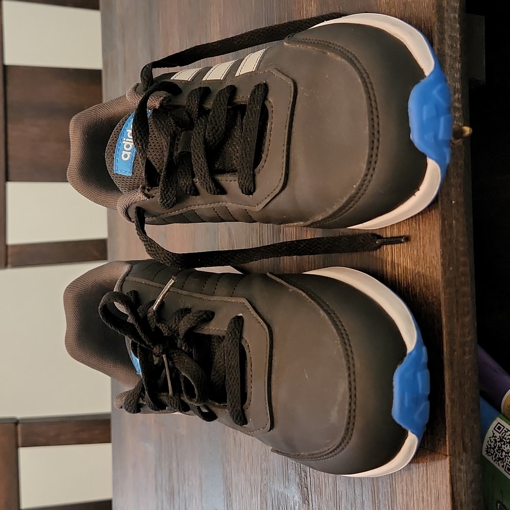 Kid size 6 black with grey adidas strips